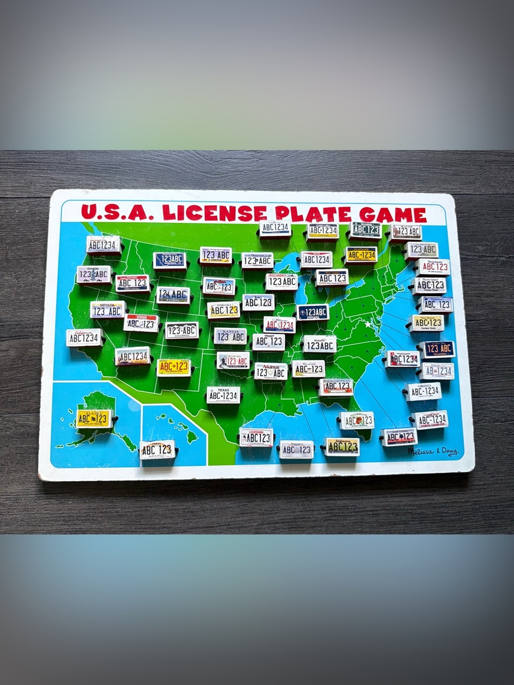 Melissa & Doug Wooden USA License Plate Car Travel Flip Game 14.5 x10 Inch Board